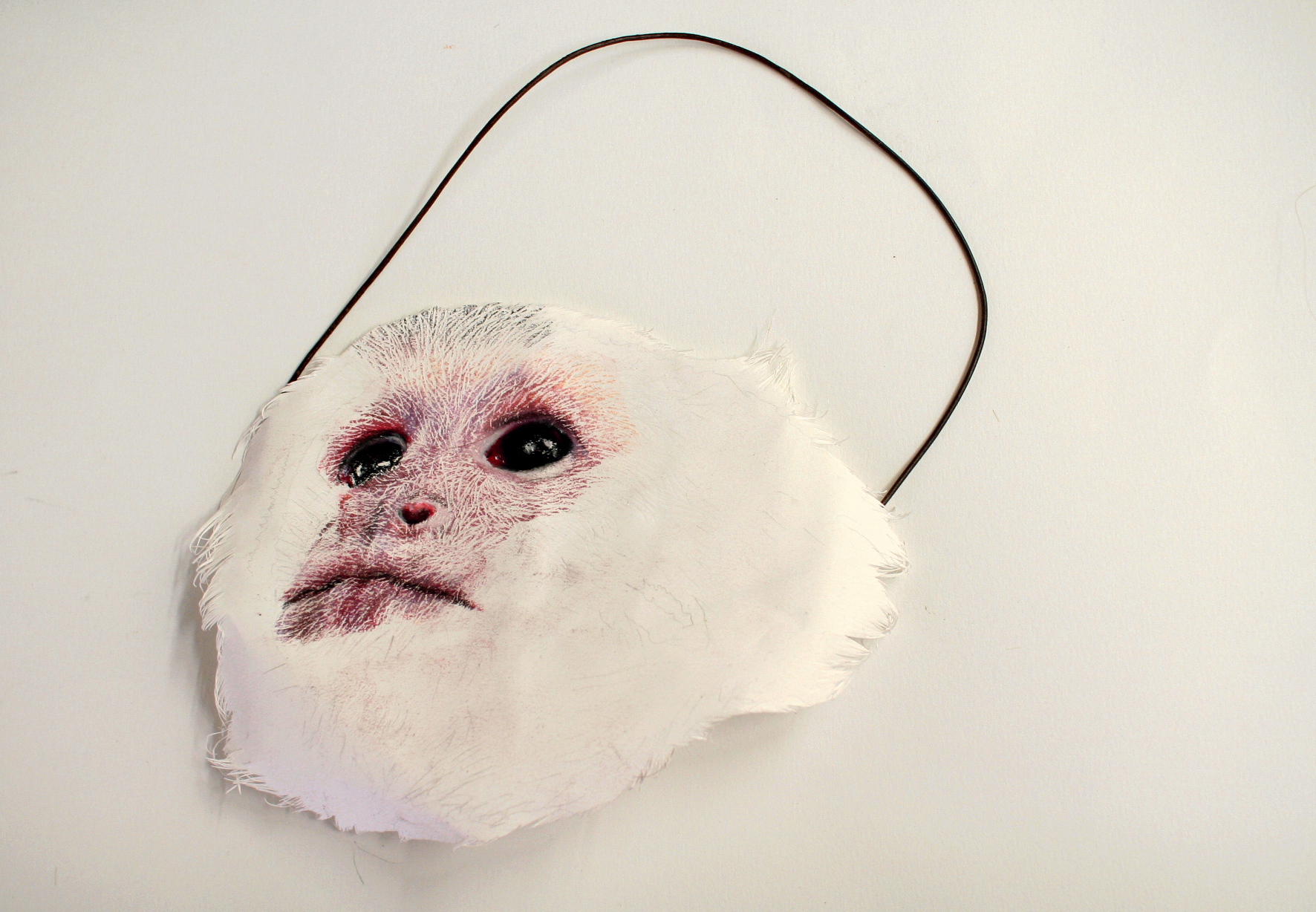 Mask: chalk pastel on papier, cutout, leather strap